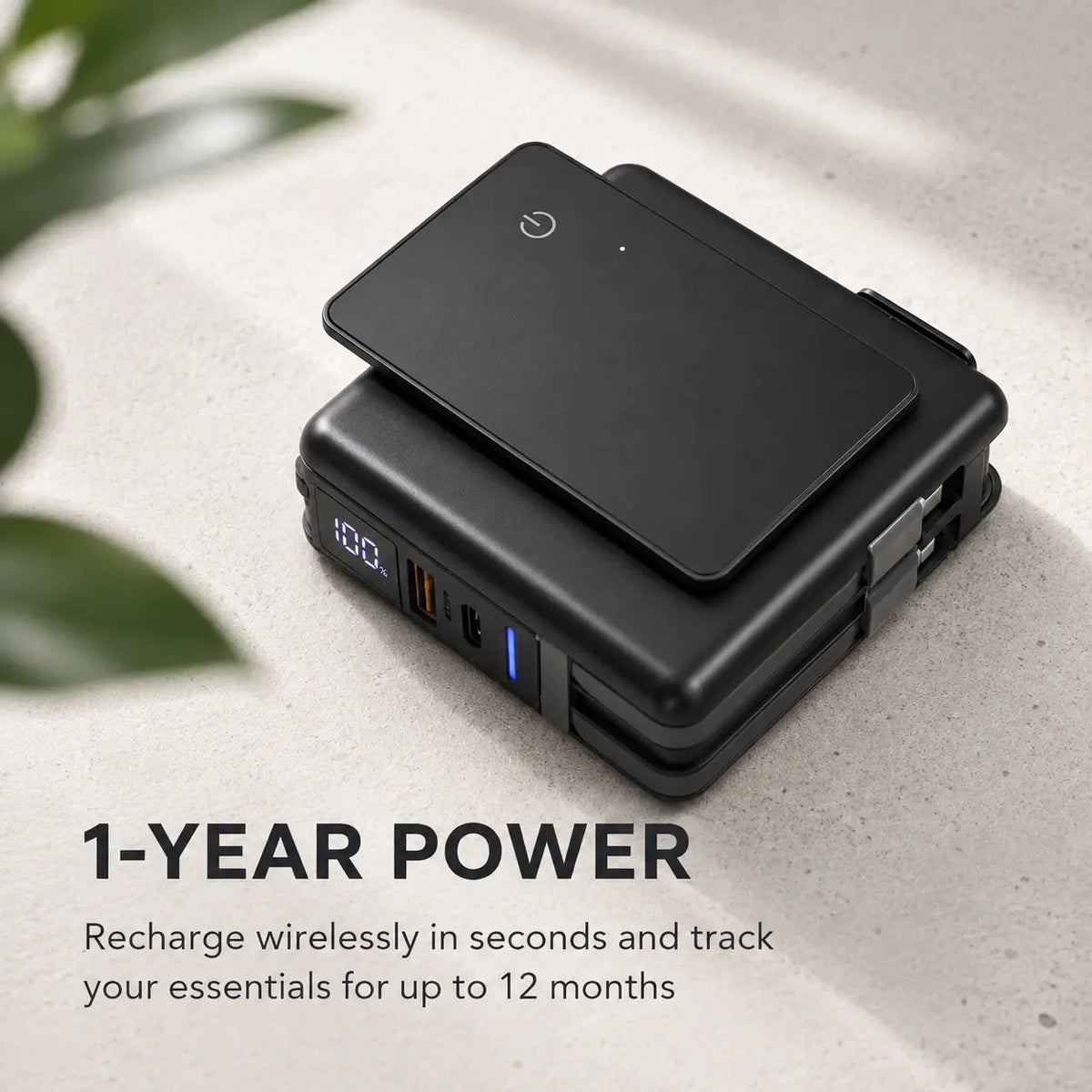 AirCard wallet tracker recharging wirelessly on a power bank