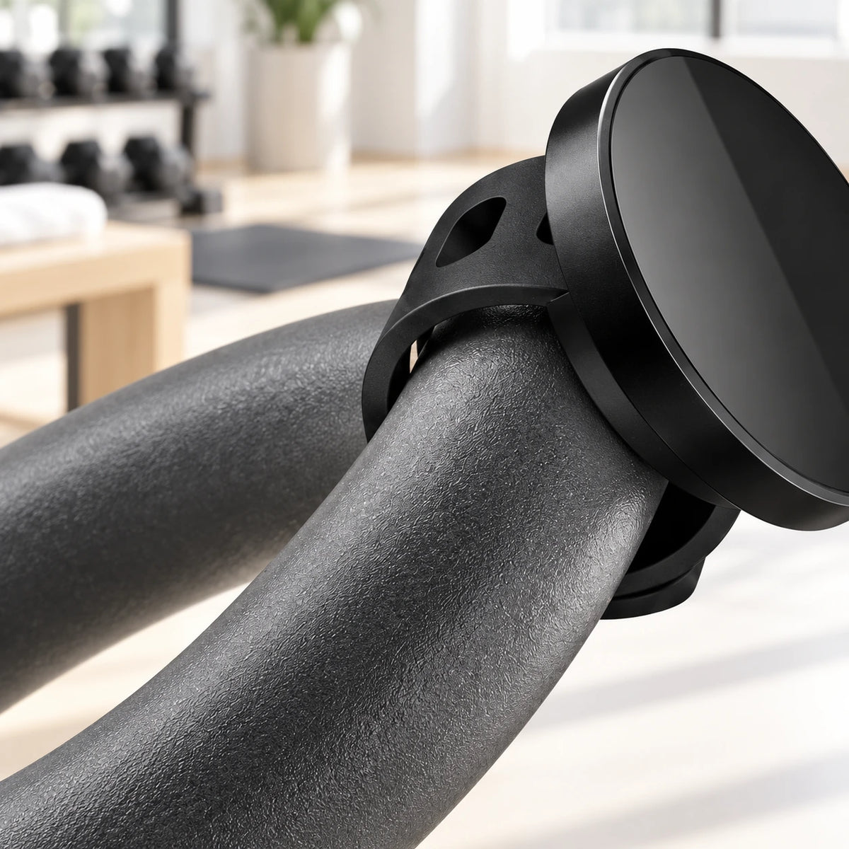 Close-up of the black mounting strap around a handlebar.