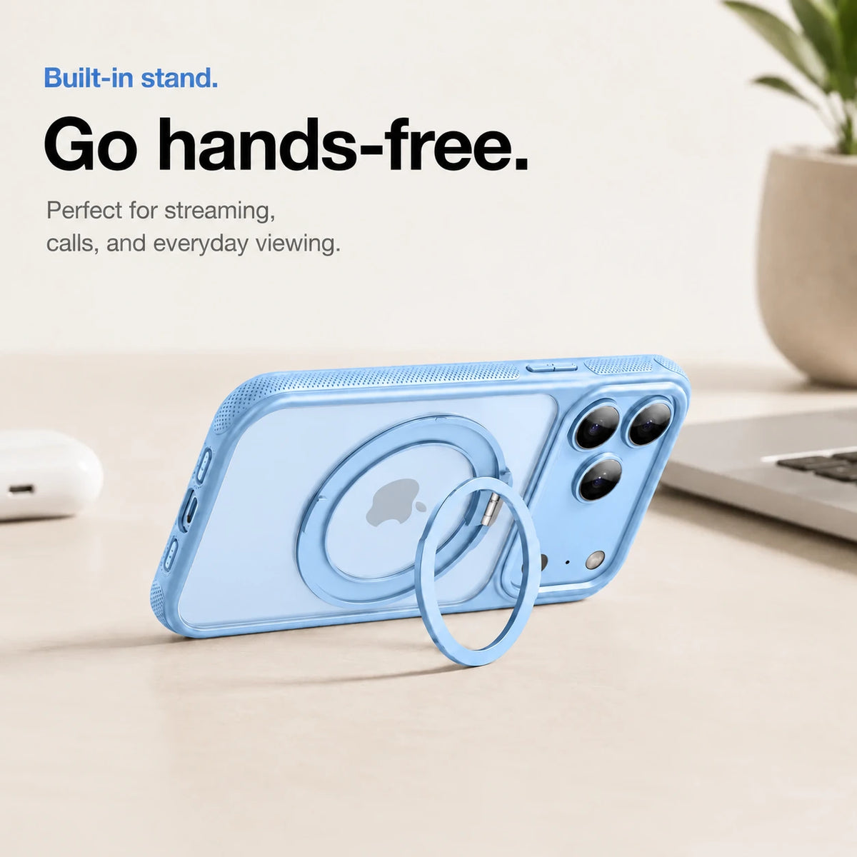 Glacier magnetic phone case propped horizontally on its ring stand beside a laptop #color_Glacier