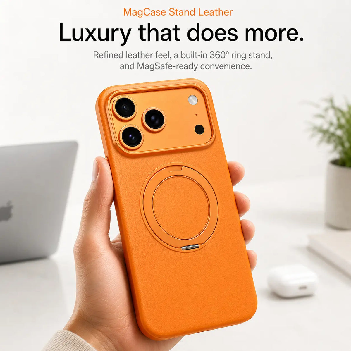 Orange leather phone case held upright at a desk with the ring stand folded flat #color_Cosmic Orange