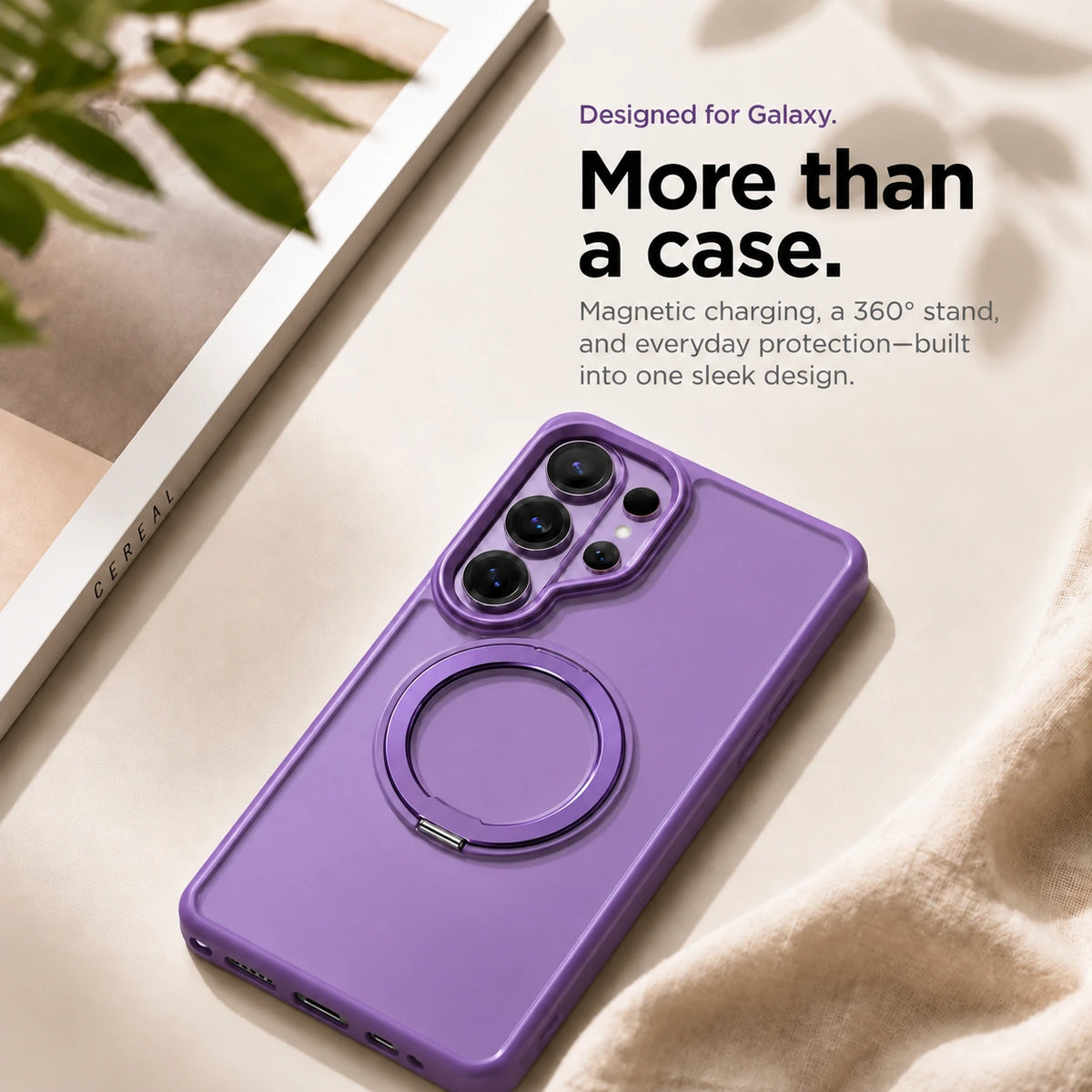 Purple ring stand phone case resting on a pale fabric surface beside a book #color_Lavender Purple